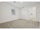 Bright, carpeted bedroom with a window and access to another room at 4673 Cross Prairie Pkwy, St Cloud, FL 34772