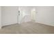 Carpeted empty bonus room with staircase at 4673 Cross Prairie Pkwy, St Cloud, FL 34772
