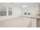 Bright living room with tiled floors, multiple windows and kitchen island at 4673 Cross Prairie Pkwy, St Cloud, FL 34772