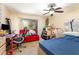 Bedroom with a ceiling fan, desk, bed, and slider to the outside at 4828 Pebble Beach Dr # A, Orlando, FL 32811