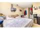 Spacious bedroom featuring a cozy bed, closet, and quirky decor at 4828 Pebble Beach Dr # A, Orlando, FL 32811