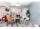 Bright dining area featuring neutral walls, light, and tile flooring at 4828 Pebble Beach Dr # A, Orlando, FL 32811