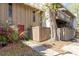 Charming home exterior featuring a unique wooden fenced entry and a mature tree at 4828 Pebble Beach Dr # A, Orlando, FL 32811