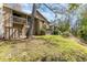 Exterior view of a multi-level condo with a patio, balcony, and lush greenery at 4828 Pebble Beach Dr # A, Orlando, FL 32811