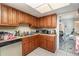 Functional kitchen area with stainless appliances and tile flooring at 4828 Pebble Beach Dr # A, Orlando, FL 32811