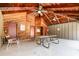 Community picnic pavilion featuring wooden construction, ceiling fans, and doors to restroom and pool access at 4828 Pebble Beach Dr # A, Orlando, FL 32811