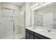 Bathroom features a glass shower and double vanity sinks at 5093 Railroad Vine Aly, Winter Garden, FL 34787