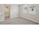 Bedroom featuring neutral walls, carpet flooring, and a light-filled windows at 5093 Railroad Vine Aly, Winter Garden, FL 34787