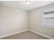 Comfortable bedroom featuring plush carpet, neutral walls, and a window allowing natural light at 5093 Railroad Vine Aly, Winter Garden, FL 34787