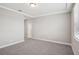 Bedroom with carpet floors, tray ceiling and trim, and a window at 5093 Railroad Vine Aly, Winter Garden, FL 34787