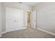 Cozy bedroom featuring plush carpet, neutral walls, and a closet with double doors at 5093 Railroad Vine Aly, Winter Garden, FL 34787