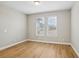 Bright living area with hardwood floors and natural light streaming through the windows at 5093 Railroad Vine Aly, Winter Garden, FL 34787