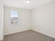 Cozy bedroom with neutral carpet, a window letting in natural light, and white walls for a clean, modern feel at 5099 Railroad Vine Aly, Winter Garden, FL 34787