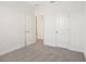 Neutral bedroom featuring an open door to another room, carpet, and white walls at 5099 Railroad Vine Aly, Winter Garden, FL 34787