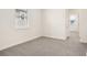 Bright bedroom with neutral carpet and natural light from a single window at 5099 Railroad Vine Aly, Winter Garden, FL 34787