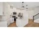 Beautiful kitchen with stainless appliances, an island, and marble backsplash at 5099 Railroad Vine Aly, Winter Garden, FL 34787