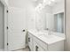 Contemporary bathroom featuring double vanity, and modern lighting fixtures at 5106 Railroad Vine Aly, Winter Garden, FL 34787
