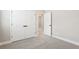 Bedroom featuring carpet, closet doors and view to another room at 5106 Railroad Vine Aly, Winter Garden, FL 34787