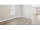 Bedroom with wood-look flooring and window with view at 5106 Railroad Vine Aly, Winter Garden, FL 34787