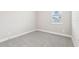 Bedroom featuring carpet, light gray walls and a single window at 5106 Railroad Vine Aly, Winter Garden, FL 34787