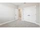 Neutral bedroom featuring gray carpet, a walk-in closet, and modern white doors at 5106 Railroad Vine Aly, Winter Garden, FL 34787