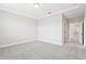 Bedroom with neutral carpet, recessed lighting, and ensuite bathroom access at 5106 Railroad Vine Aly, Winter Garden, FL 34787