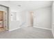 Hallway area featuring neutral colored walls, carpet and laundry appliances at 5106 Railroad Vine Aly, Winter Garden, FL 34787