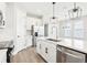 A bright kitchen with modern appliances, a large center island, and an open layout at 5106 Railroad Vine Aly, Winter Garden, FL 34787