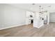 Open concept floor plan features a stylish kitchen with a white island and stainless steel appliances at 5106 Railroad Vine Aly, Winter Garden, FL 34787