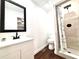 Bathroom featuring new vanity, tile shower with rainfall shower head, and updated fixtures at 5390 E Hinson Ave, Haines City, FL 33844