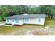Charming single-story home featuring a newer roof, updated windows and a freshly painted exterior at 5390 E Hinson Ave, Haines City, FL 33844