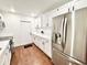 Modern kitchen featuring white cabinets, stainless steel appliances, and sleek countertops at 5390 E Hinson Ave, Haines City, FL 33844