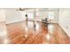 Spacious living room with refinished wood floors and lots of natural light from the windows at 5390 E Hinson Ave, Haines City, FL 33844