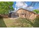 Spacious backyard featuring a screened lanai and a well-maintained lawn at 5580 Berwood Dr, Orlando, FL 32810