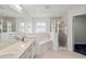 Elegant bathroom featuring dual sinks, a soaking tub, and a separate glass shower at 5580 Berwood Dr, Orlando, FL 32810