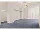 Large bedroom with neutral walls, carpeting, ceiling fan and double door closet at 5580 Berwood Dr, Orlando, FL 32810