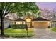 Charming single-Gathering home featuring a well-manicured lawn, a two-car garage, and a welcoming entrance at 5580 Berwood Dr, Orlando, FL 32810