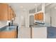 Bright kitchen features wood cabinetry, modern appliances, and an open layout at 5580 Berwood Dr, Orlando, FL 32810