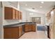 Bright kitchen features wood cabinetry, modern appliances, and an open layout at 5580 Berwood Dr, Orlando, FL 32810