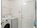 Clean and tidy laundry room with modern appliances including washer and dryer at 5580 Berwood Dr, Orlando, FL 32810