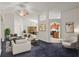 Spacious living room with vaulted ceilings and views of the kitchen and dining area at 5580 Berwood Dr, Orlando, FL 32810