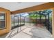 Covered screened patio with a view of the backyard at 5580 Berwood Dr, Orlando, FL 32810