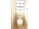 Small half bathroom features standard toilet and window at 559 Northbridge Dr, Altamonte Springs, FL 32714