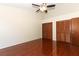 Bedroom with ceiling fan, closet space, and hardwood floors at 559 Northbridge Dr, Altamonte Springs, FL 32714