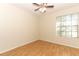 Bright bedroom with laminate floors, ceiling fan and large window at 559 Northbridge Dr, Altamonte Springs, FL 32714