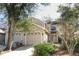 Charming home featuring a multi-car garage and a beautifully landscaped front yard with mature trees at 559 Northbridge Dr, Altamonte Springs, FL 32714