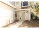 Close-up of the front entrance, showcasing the neutral exterior and manicured walkway at 559 Northbridge Dr, Altamonte Springs, FL 32714
