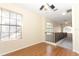Upstairs hall featuring wood laminate flooring and a staircase with metal railing at 559 Northbridge Dr, Altamonte Springs, FL 32714