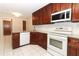 Renovated kitchen boasts stainless steel appliances, granite countertops and white tile flooring at 559 Northbridge Dr, Altamonte Springs, FL 32714