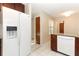 Bright kitchen features white appliances, granite countertops and white tile flooring at 559 Northbridge Dr, Altamonte Springs, FL 32714